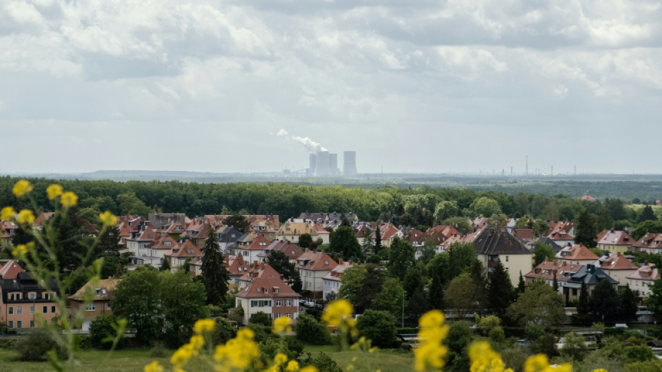 Vista of houses in Sheffield with a power plant on the horizon